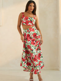 Rose Romance Two-Piece Set featuring bold red rose print, crop top with lace trim, and flattering silhouette.