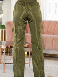 Back view of V Cut Cargo Pants in olive green, showcasing wide legs and side cargo pockets for a stylish utilitarian look.