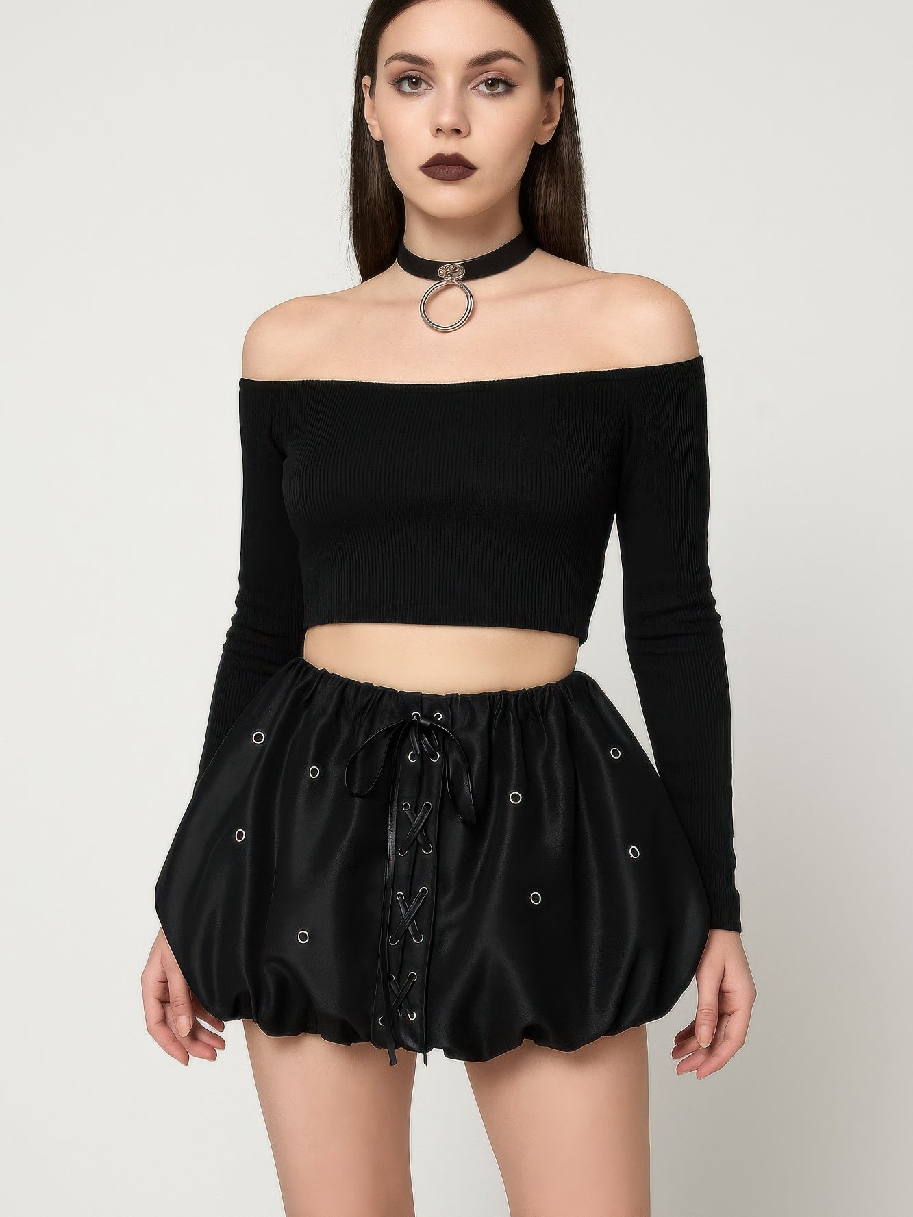 Model wearing a Bubble Lace Up Mini Skirt with a lace-up front and puffed silhouette, paired with an off-shoulder top.
