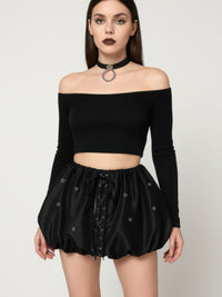 Model wearing a Bubble Lace Up Mini Skirt with a lace-up front and puffed silhouette, paired with an off-shoulder top.