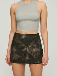Model wearing a Mid Waist Mini Skirt with edgy zipper detail, paired with a gray crop top.