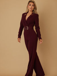 Blazer jumpsuit for women in burgundy with long sleeves, cinched waist and oversized square buckle.