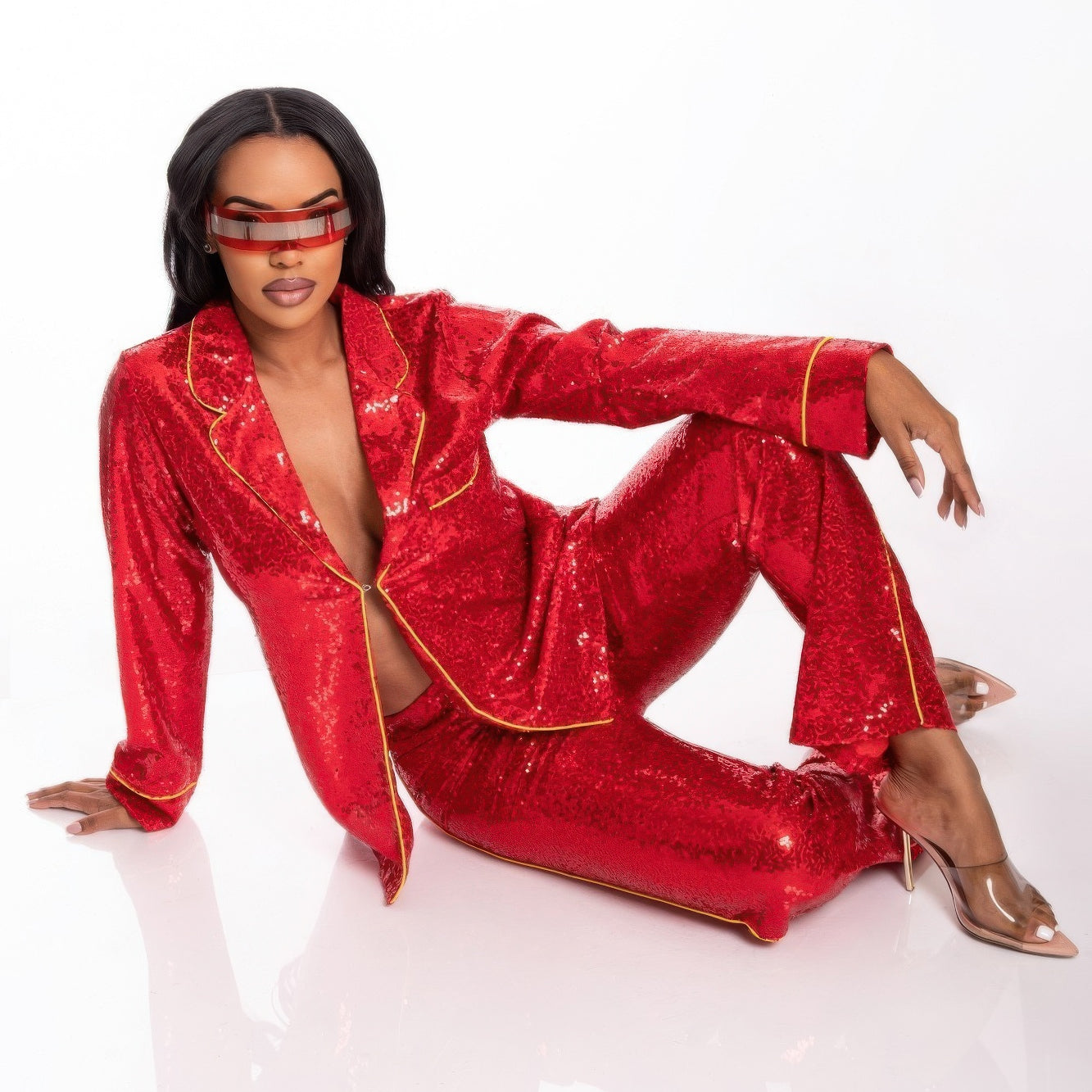Model wearing Sequin Collared Two Piece Set in red, showcasing modern elegance and a stylish silhouette.