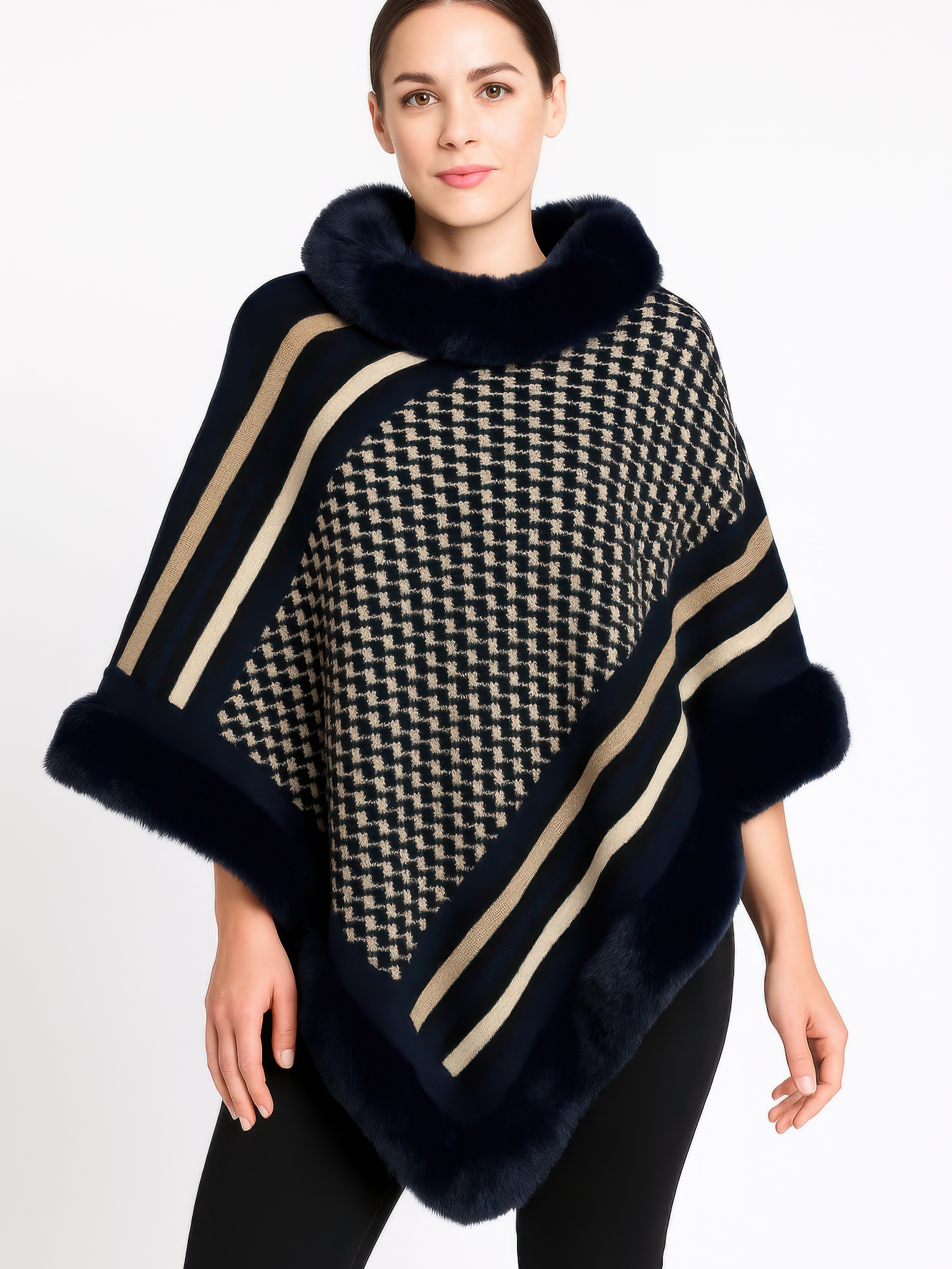 Model wearing a stylish Patterned Knit Poncho With Faux Fur Trim in navy and beige geometric design.