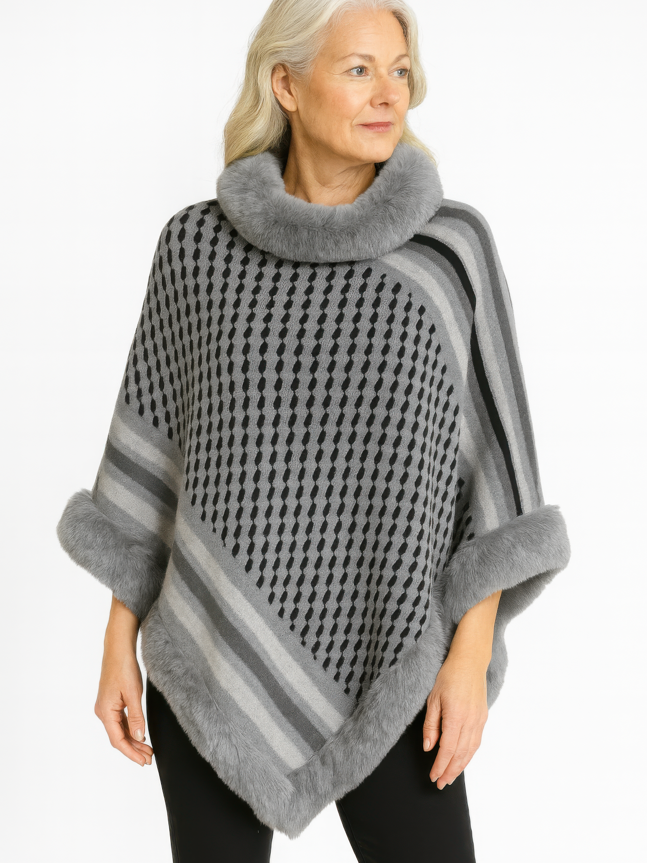Patterned Knit Poncho With Faux Fur Trim in gray geometric design worn by a woman.