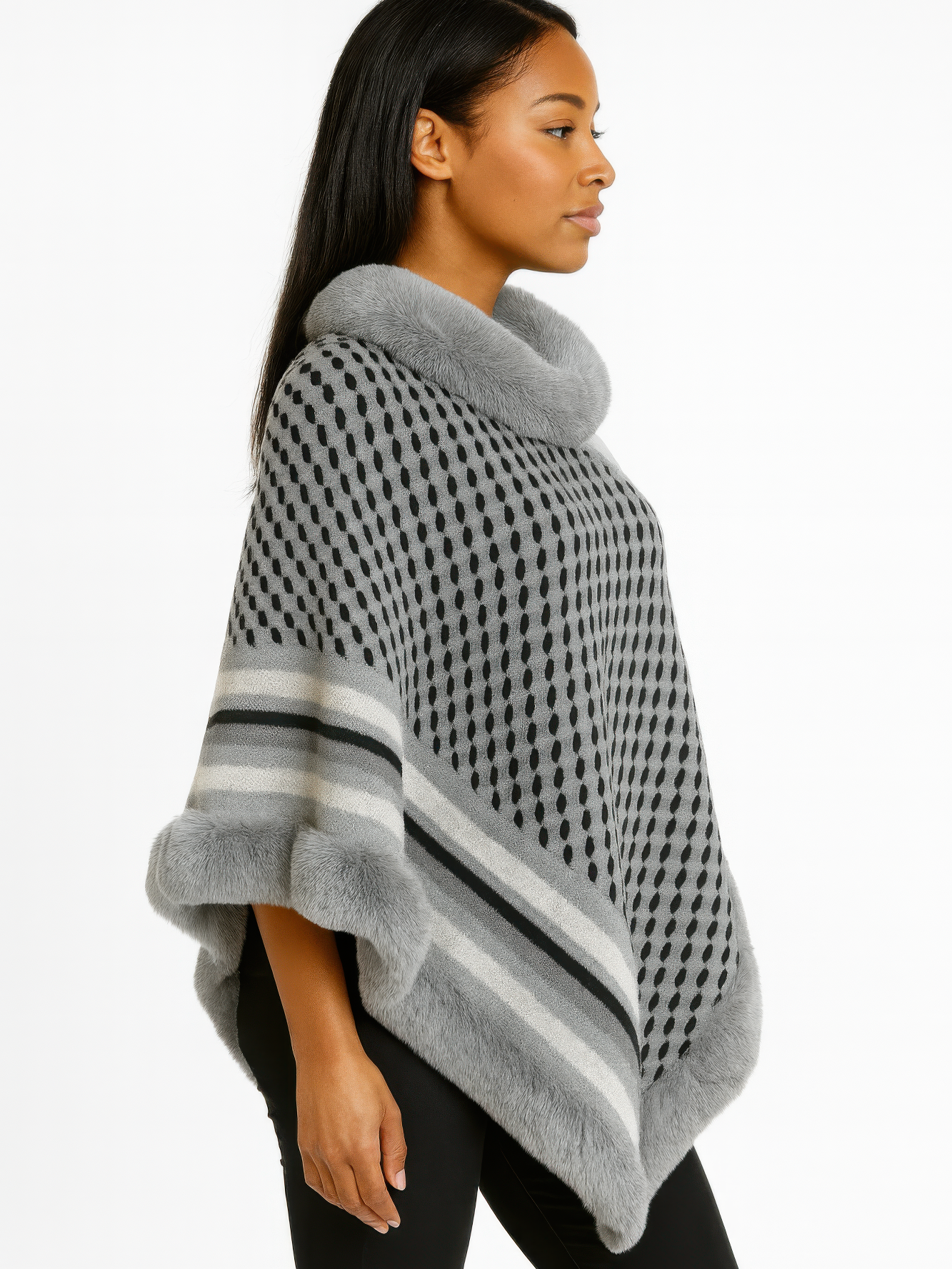Patterned Knit Poncho With Faux Fur Trim worn by a model showcasing its stylish and cozy design.