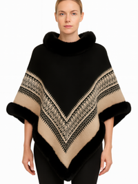 Chevron Trim Poncho With Faux Fur Collar worn by a model, featuring a black knit and camel chevron design.