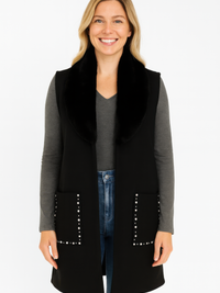 Sleeveless Wool-Blend Vest With Faux Fur Collar worn by a smiling woman, featuring a stylish open-front design and decorative studs.