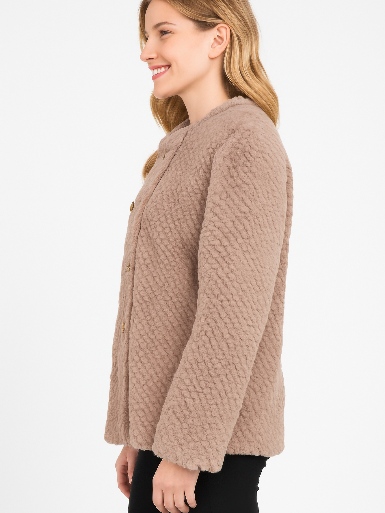 Model wearing a side view of the Textured Double-Breasted Faux Shearling Jacket in a warm beige tone.