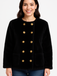 Textured Double-Breasted Faux Shearling Jacket worn by a smiling woman, featuring gold buttons and side pockets.