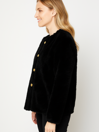 Textured Double-Breasted Faux Shearling Jacket in black, featuring a soft texture and gold buttons, shown from the side.