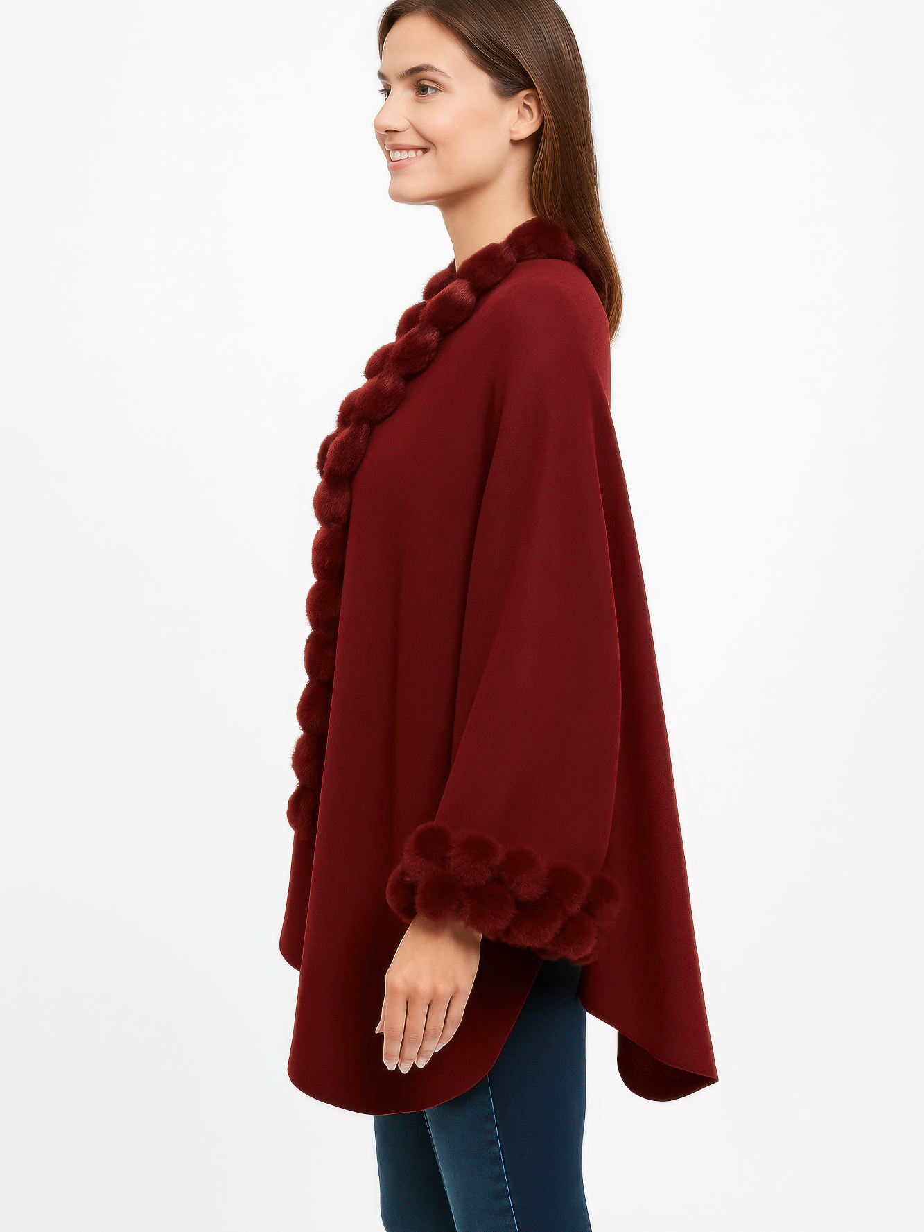 Open-Front Cape With Pom Faux Fur Trim in burgundy worn by a smiling woman, featuring plush pom trims for stylish layering.