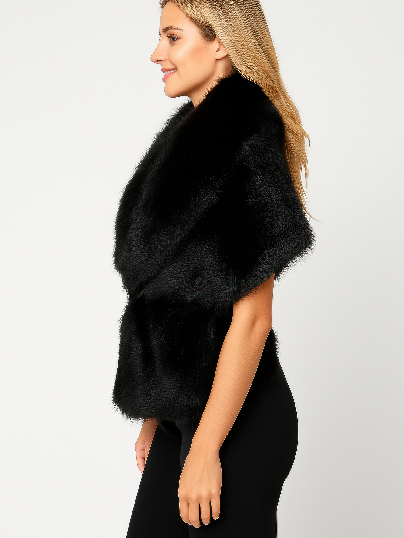 Black faux fur sleeveless vest with cinched waist, side view