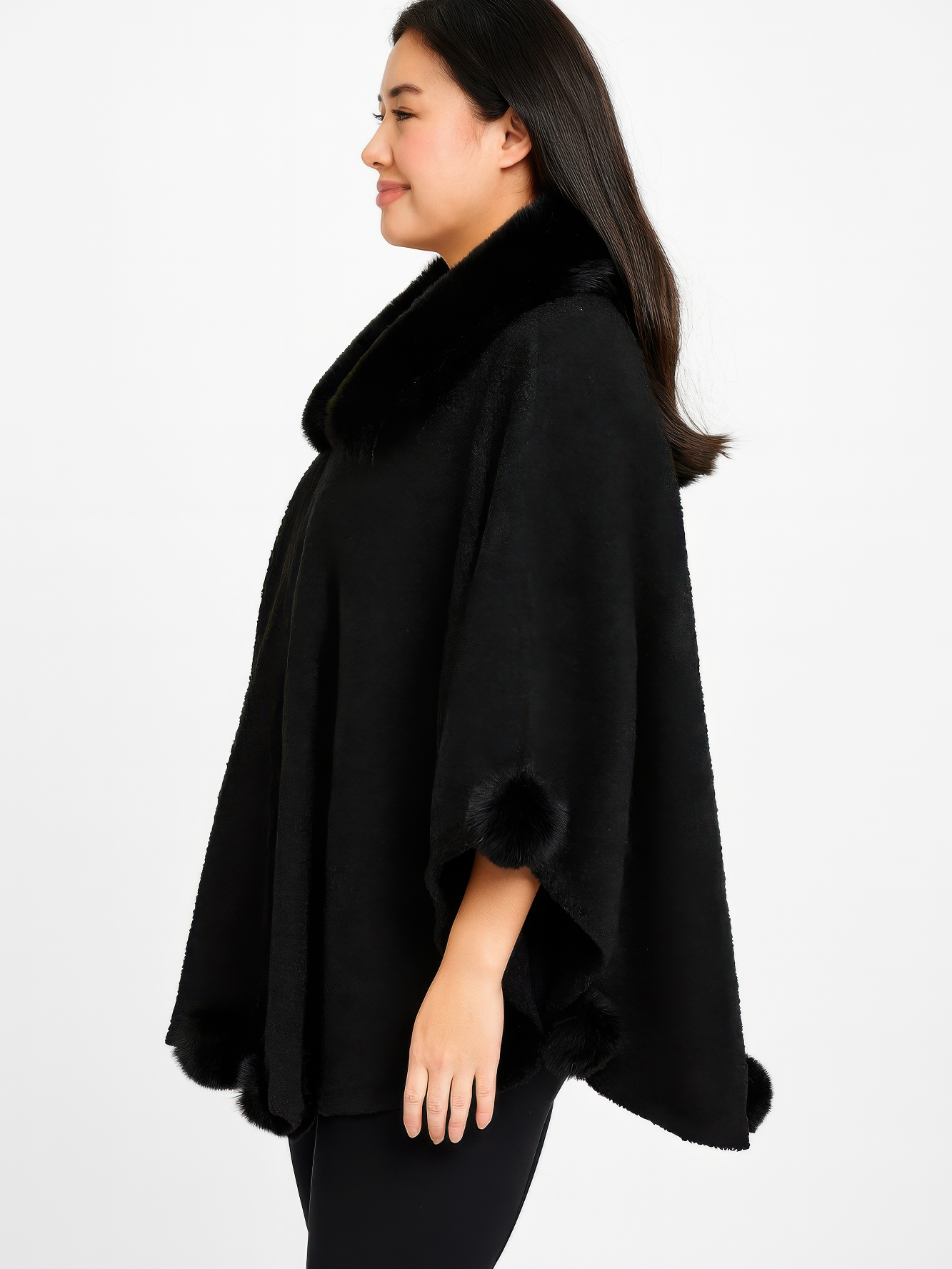 Trim Cape With Faux Fur Collar displayed on a model, showcasing its cozy bouclé fabric and playful pom trim.