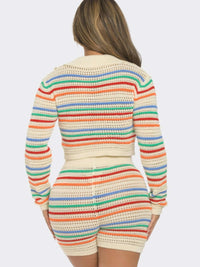Back view of a woman wearing a Striped Knit Set featuring a cropped collared top and matching shorts.