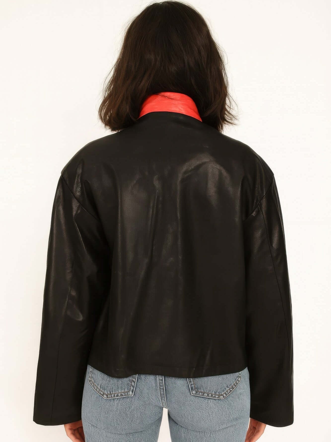 Back view of 1988 Vintage Motor Jacket in black leather with red collar, showcasing its sleek design and structure.