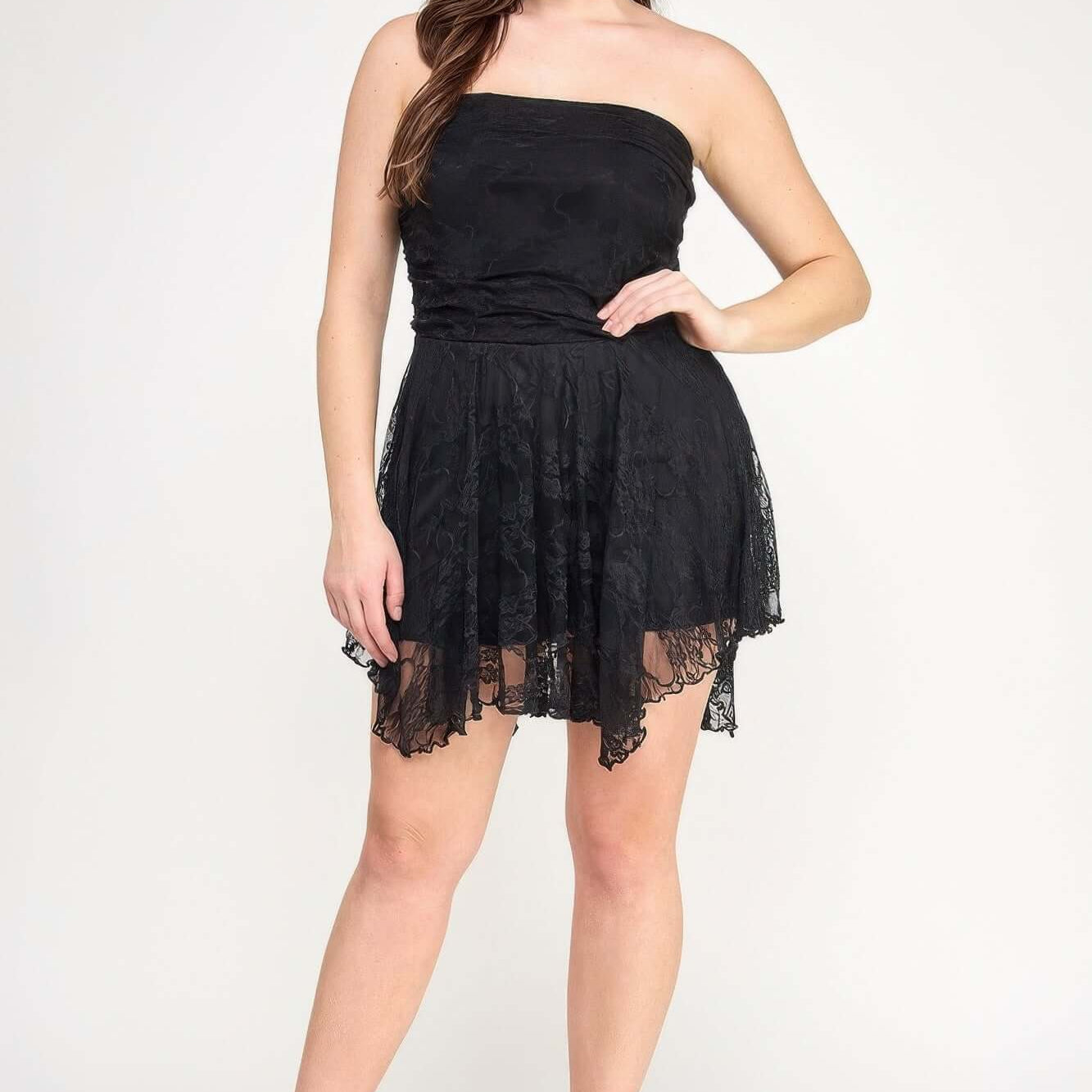 Plus Size Ots Lace Overlay Assym Dress on a model with a stylish black lace design and asymmetrical hem.