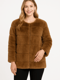 Plush Camel Faux Fur Jacket worn by a smiling model, showcasing a modern collarless design and cozy texture.