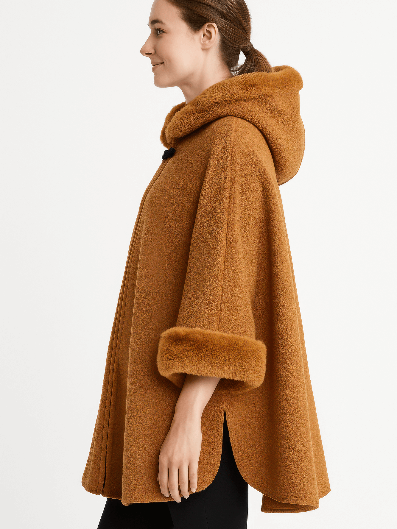 Side view of a model wearing a Hooded Faux Fur Trim Cape in warm brown, showcasing its elegant design and luxurious fur trim.