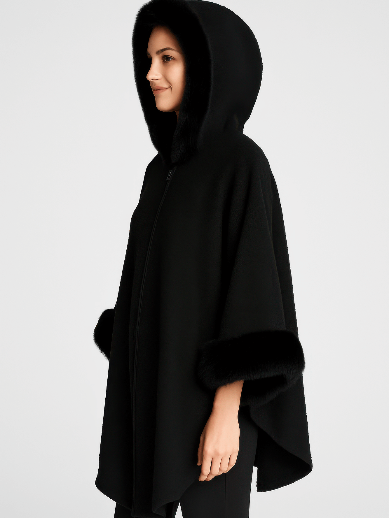 Hooded Faux Fur Trim Cape in black, featuring plush faux fur trim, a roomy hood, and wide sleeves for elegant warmth.