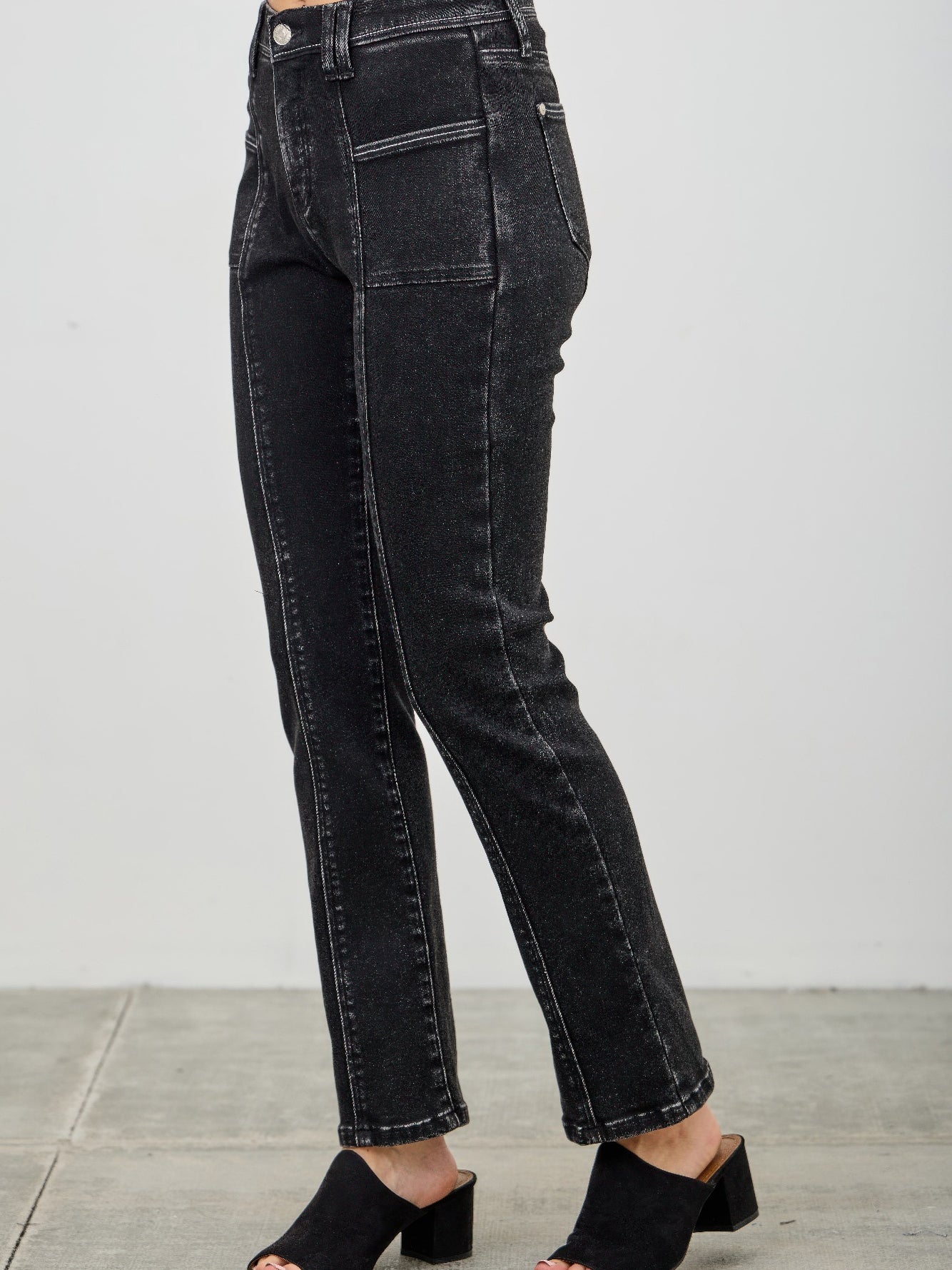 Mid Rise Slim Straight In Black Acid showcasing a sleek black acid wash denim silhouette.