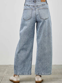Back view of High Rise Low Curve Barrel jeans showcasing their roomy barrel leg and high-rise waist.
