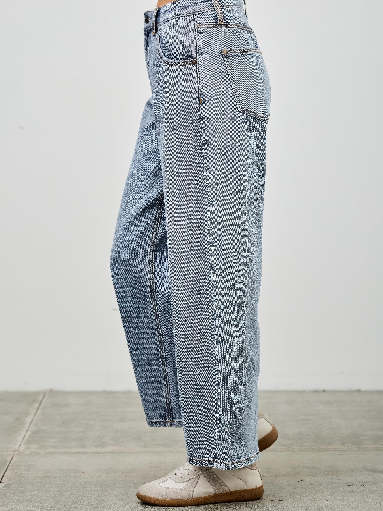 High Rise Low Curve Barrel jeans in light wash with a high-rise waist and roomy barrel leg profile.