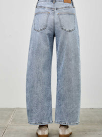 Back view of High Rise Low Curve Barrel jeans showcasing roomy barrel leg and high-rise waist.