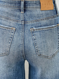 High Rise Wide Leg W/release Hem And Side Contrast - back view showcasing pockets and denim texture.