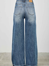 High Rise Wide Leg W/release Hem And Side Contrast view from the back showcasing the relaxed fit and release hem.