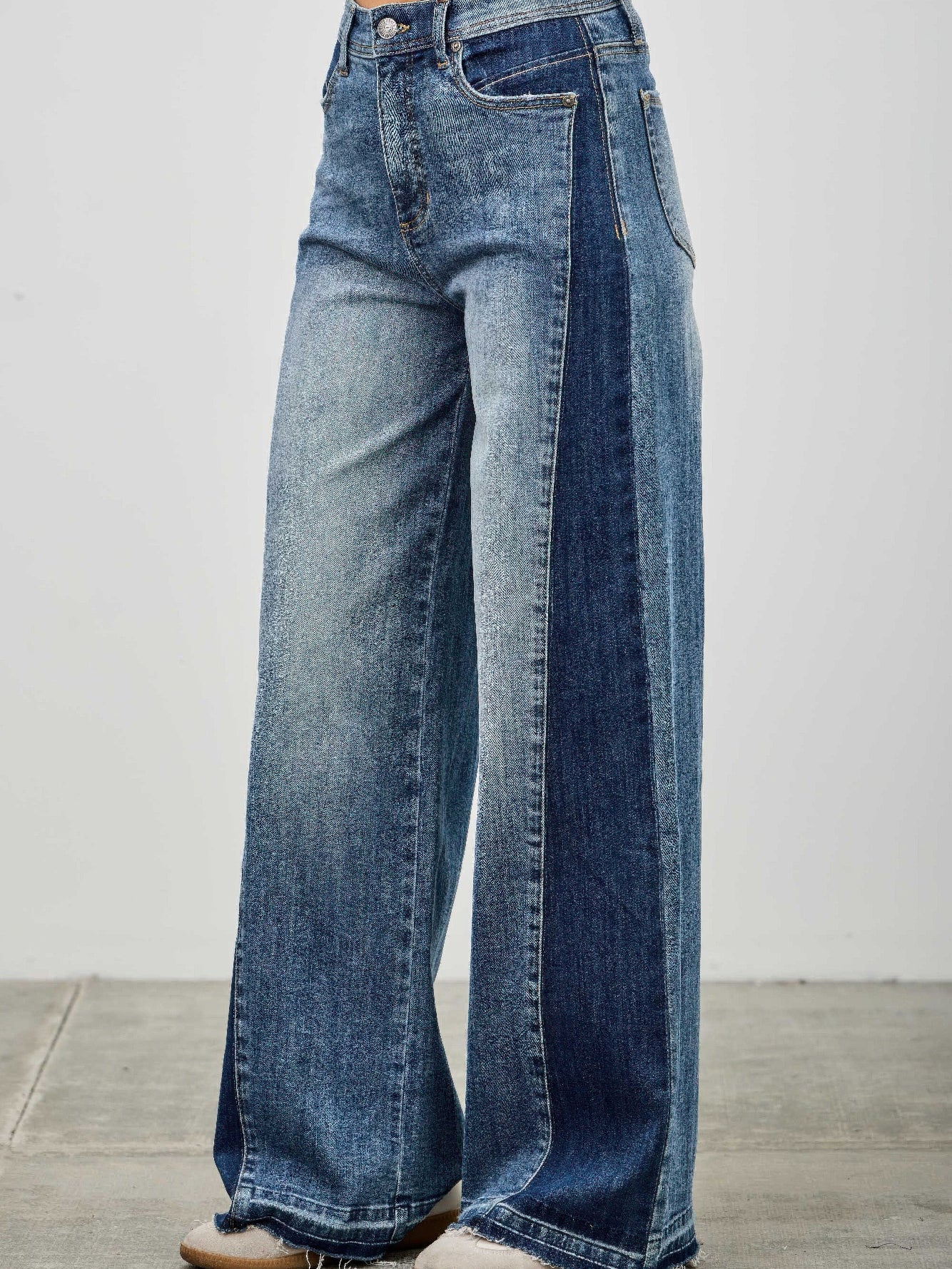 High Rise Wide Leg W/release Hem And Side Contrast featuring raw hem and contrast paneling in denim.