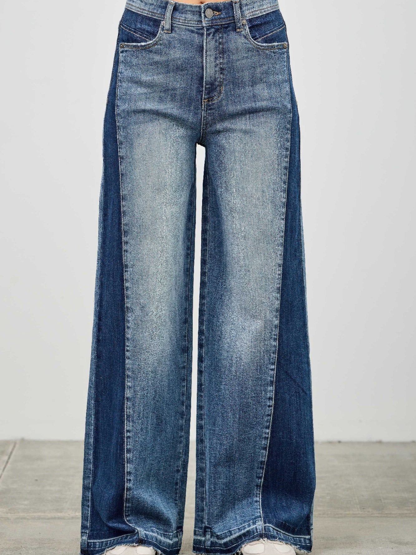 High Rise Wide Leg W/release Hem And Side Contrast showcasing bold style with raw hem and side paneling.