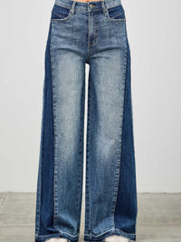 High Rise Wide Leg W/release Hem And Side Contrast showcasing bold style with raw hem and side paneling.