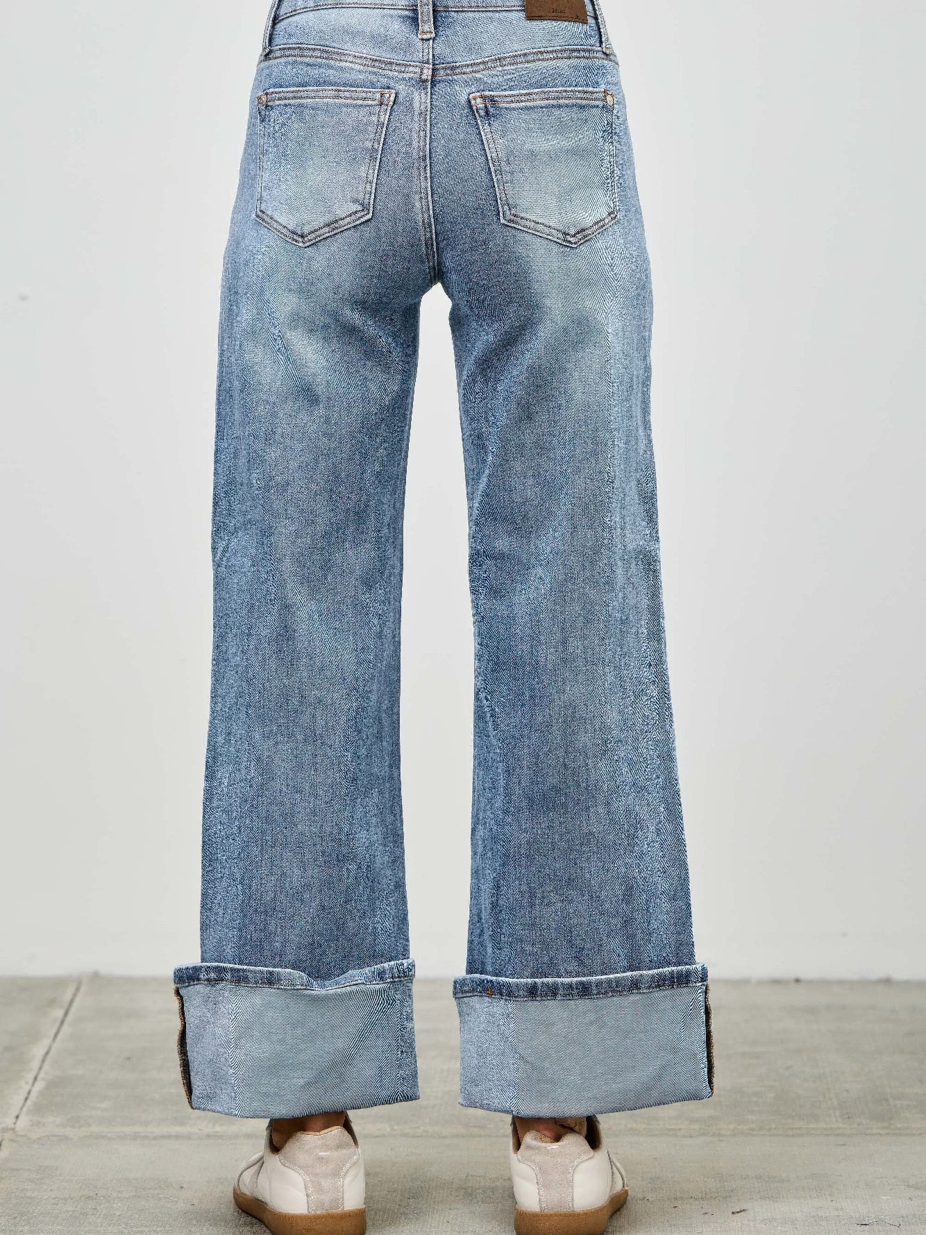Mid Rise Cuffed Jeans With Stretch displayed from the back, showing the cuffed hem and flattering fit.