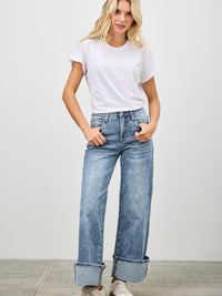 Mid Rise Cuffed Jeans With Stretch modeled with a white t-shirt and sneakers, showcasing a stylish casual look.