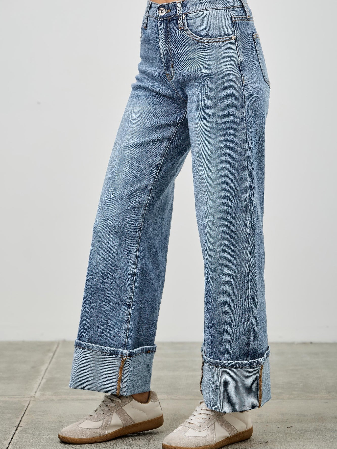 Mid Rise Cuffed Jeans With Stretch showcased on a model wearing casual sneakers.