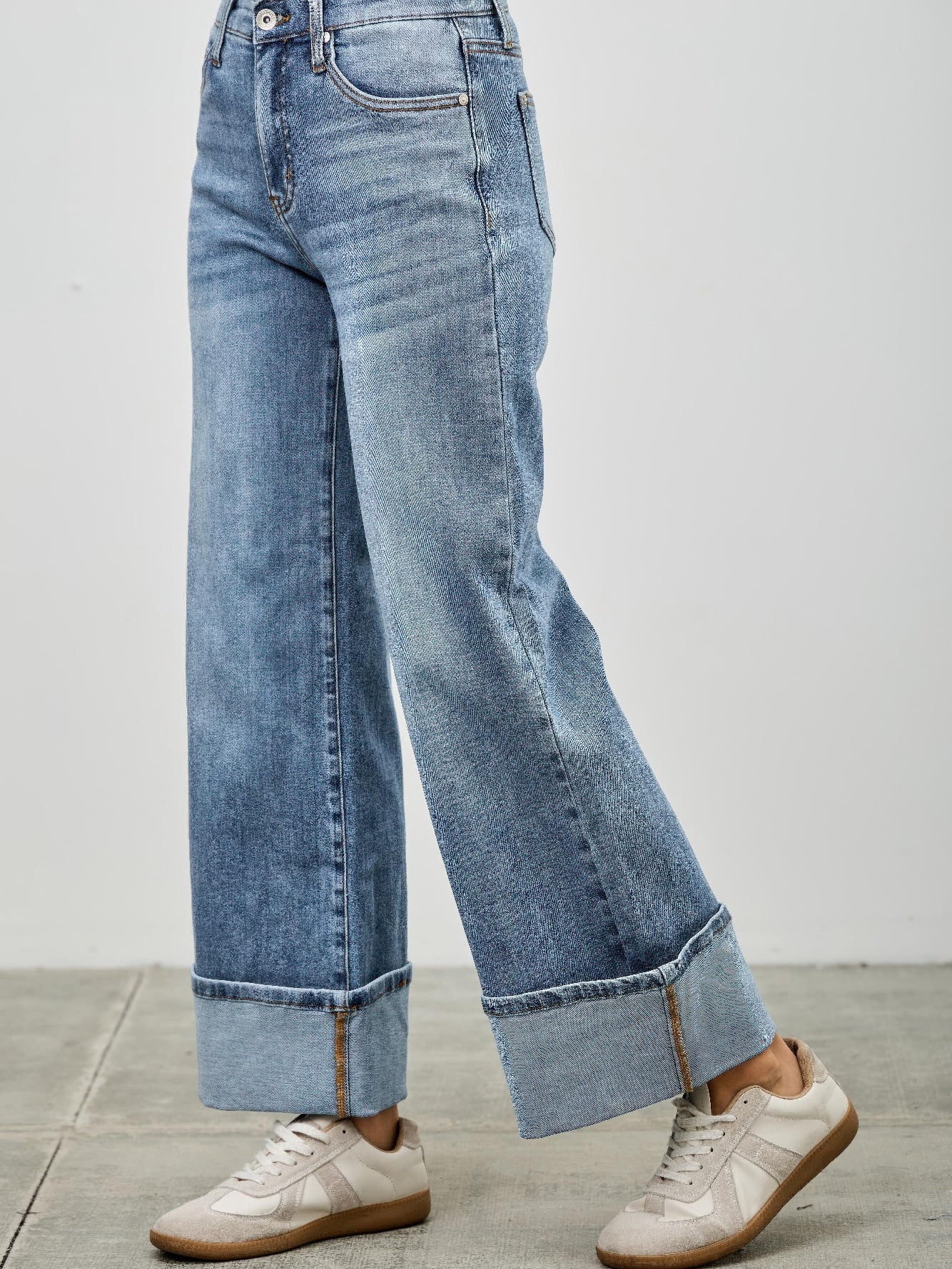 Mid Rise Cuffed Jeans With Stretch styled with casual sneakers, showcasing a polished look and comfortable fit.