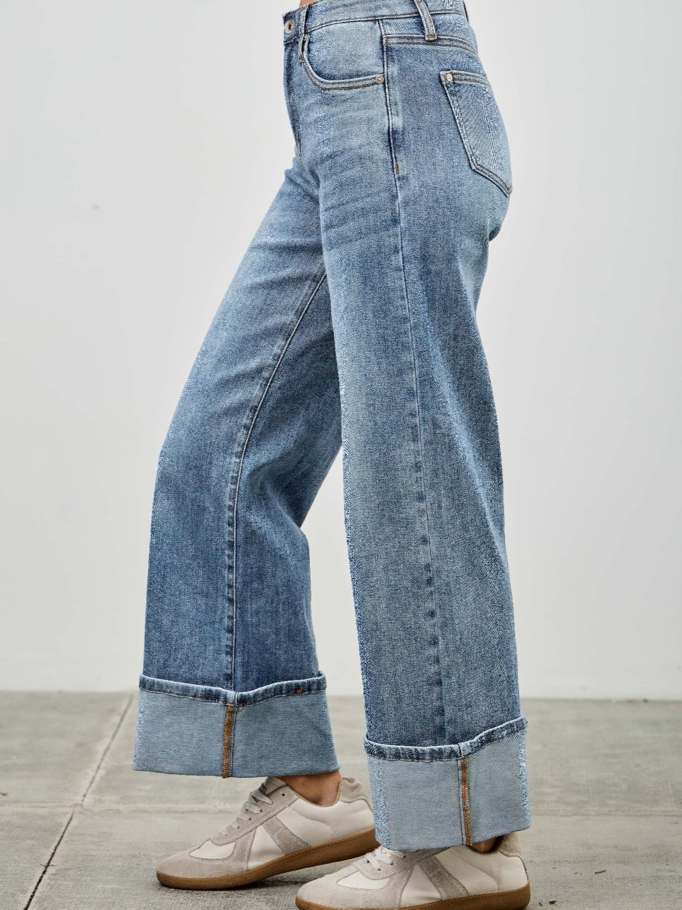 Mid Rise Cuffed Jeans With Stretch featured in casual styling with sneakers, showcasing their versatile and comfortable fit.