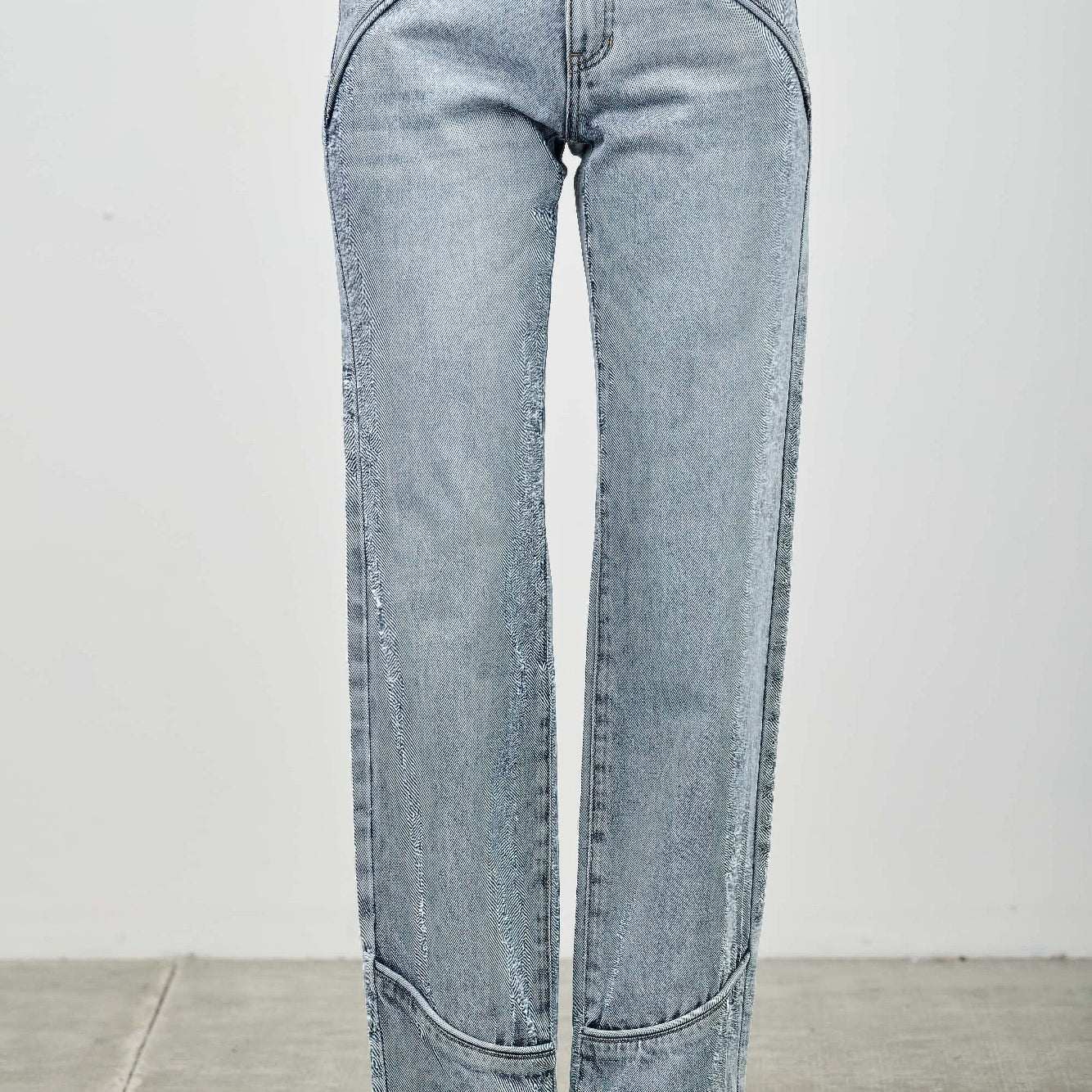 Mid Rise Straight With Piping featuring subtle piping detail along the seams in a light denim finish.