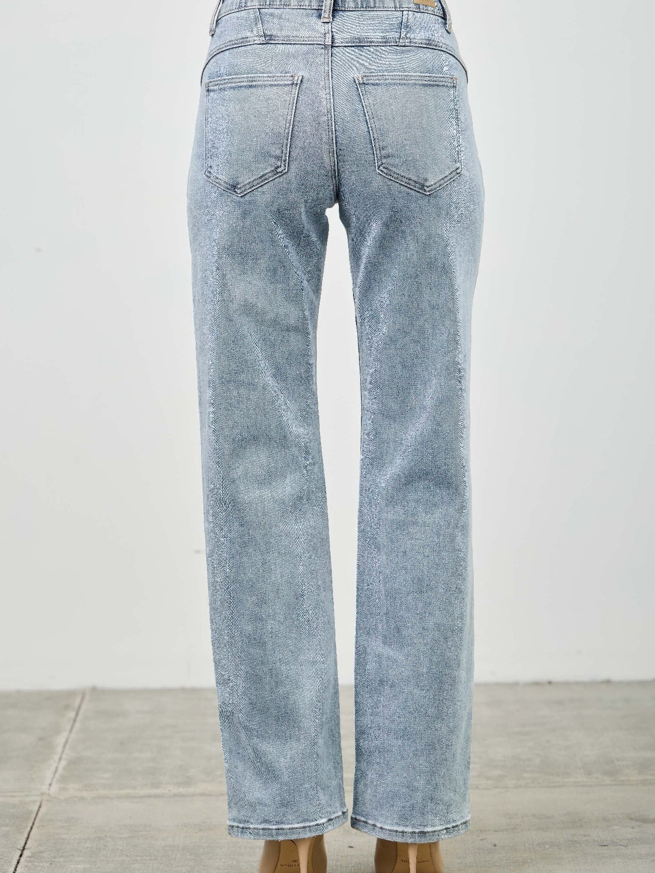 Back view of mid rise straight jeans with piping detail, showcasing a clean and tailored look.