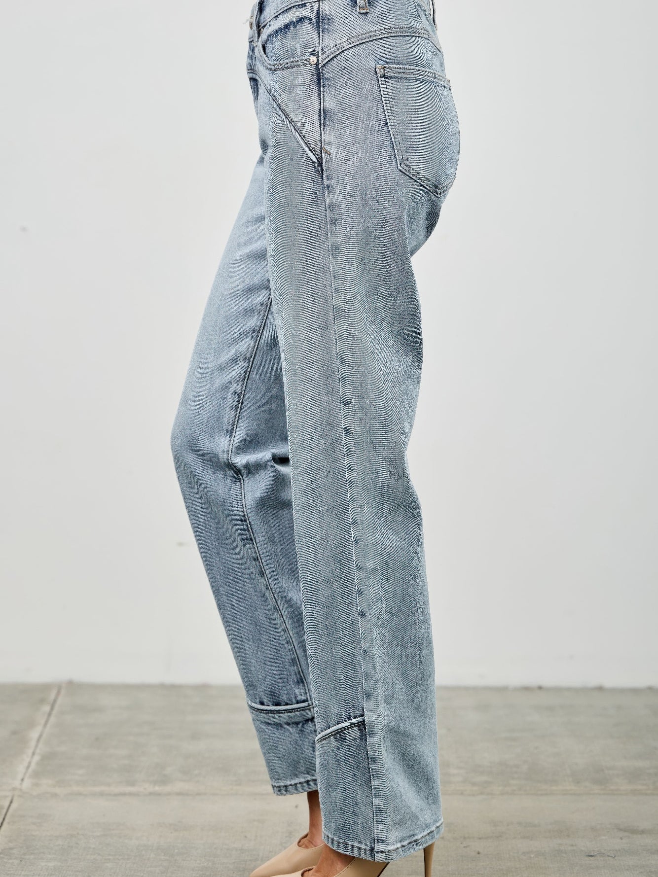 Mid Rise Straight With Piping side view showcasing straight-leg cut and subtle design details.