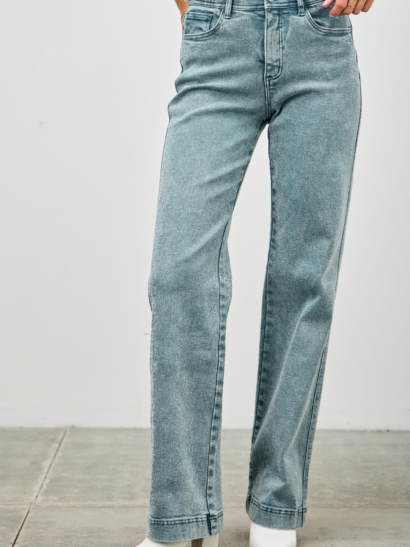 High Rise Slim Wide Straight jeans featuring a comfortable high-rise waist and straight leg cut.