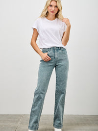 Model wearing High Rise Slim Wide Straight jeans with a white t-shirt and stylish ankle boots.