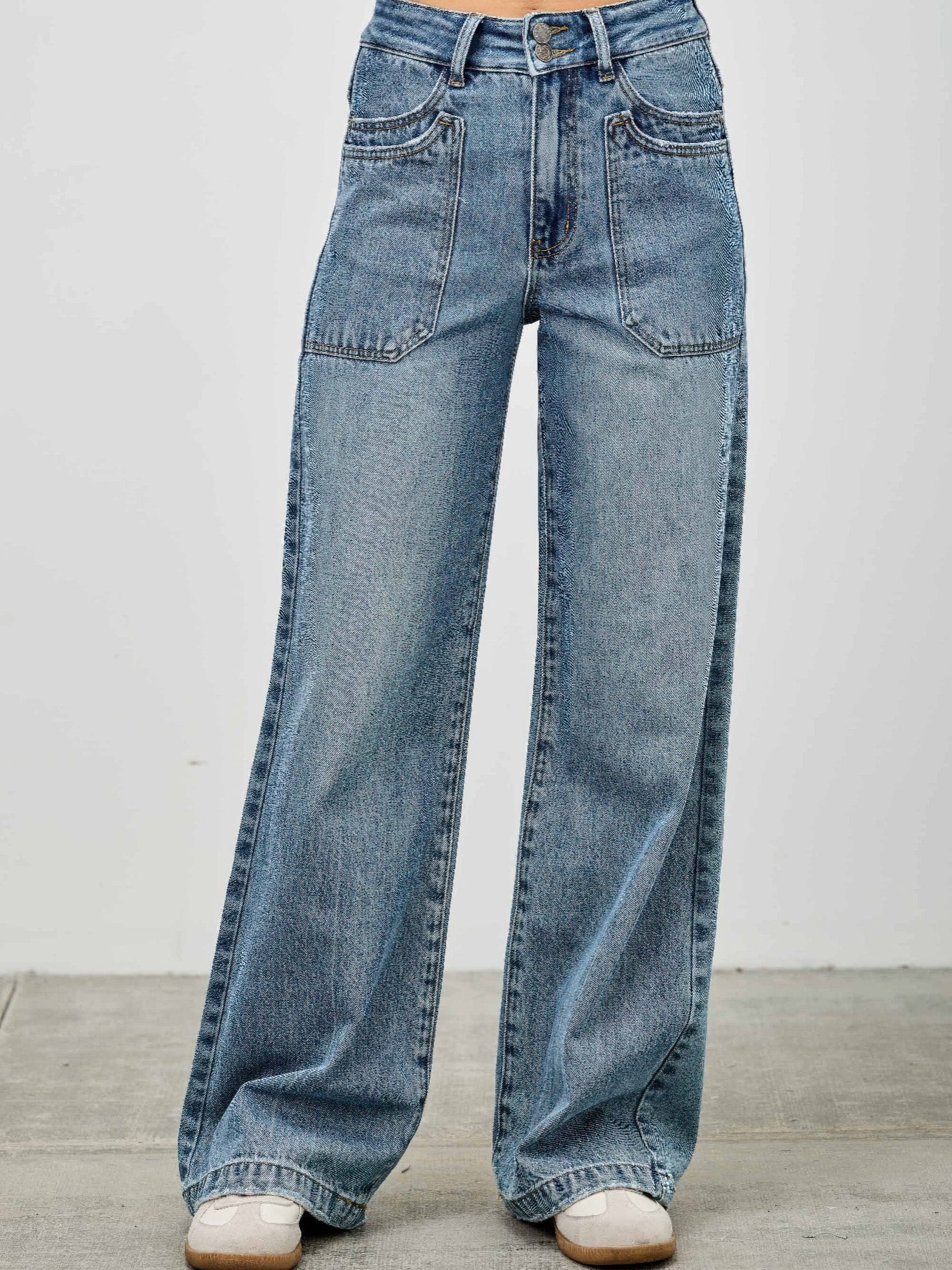 High Rise Double Pocket Wide Leg jeans with patched front pockets and wide leg silhouette, offering style and comfort.