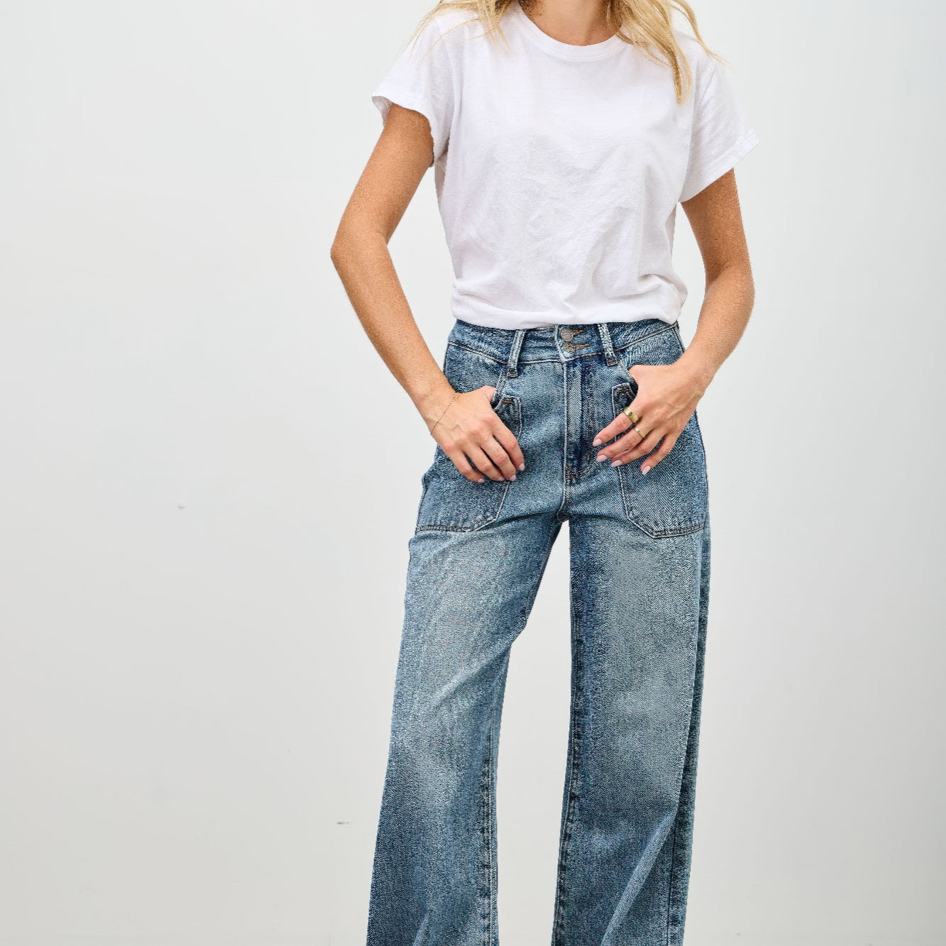 Model wearing High Rise Double Pocket Wide Leg jeans with a white t-shirt and relaxed fit pose.
