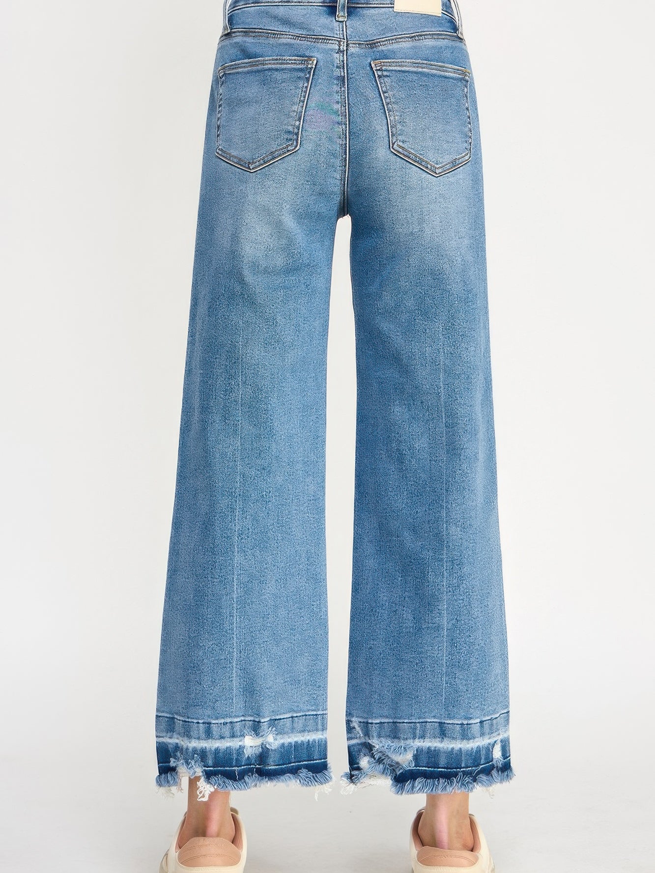 Tummy Control High Rise Crop Wide W/ Released Hem back view showing relaxed fit and distressed hem.