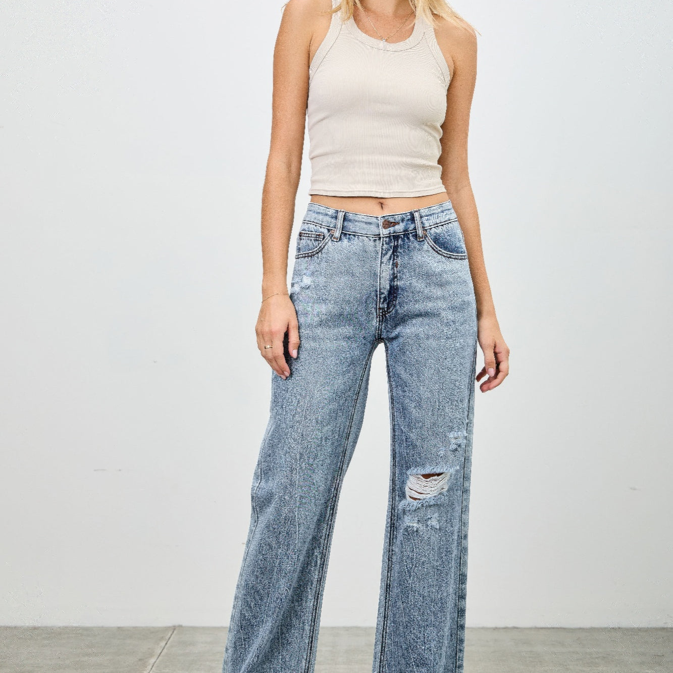 Model wearing Mid Rise Relaxed Straight With Destroy jeans, showcasing relaxed fit and destroyed detailing.