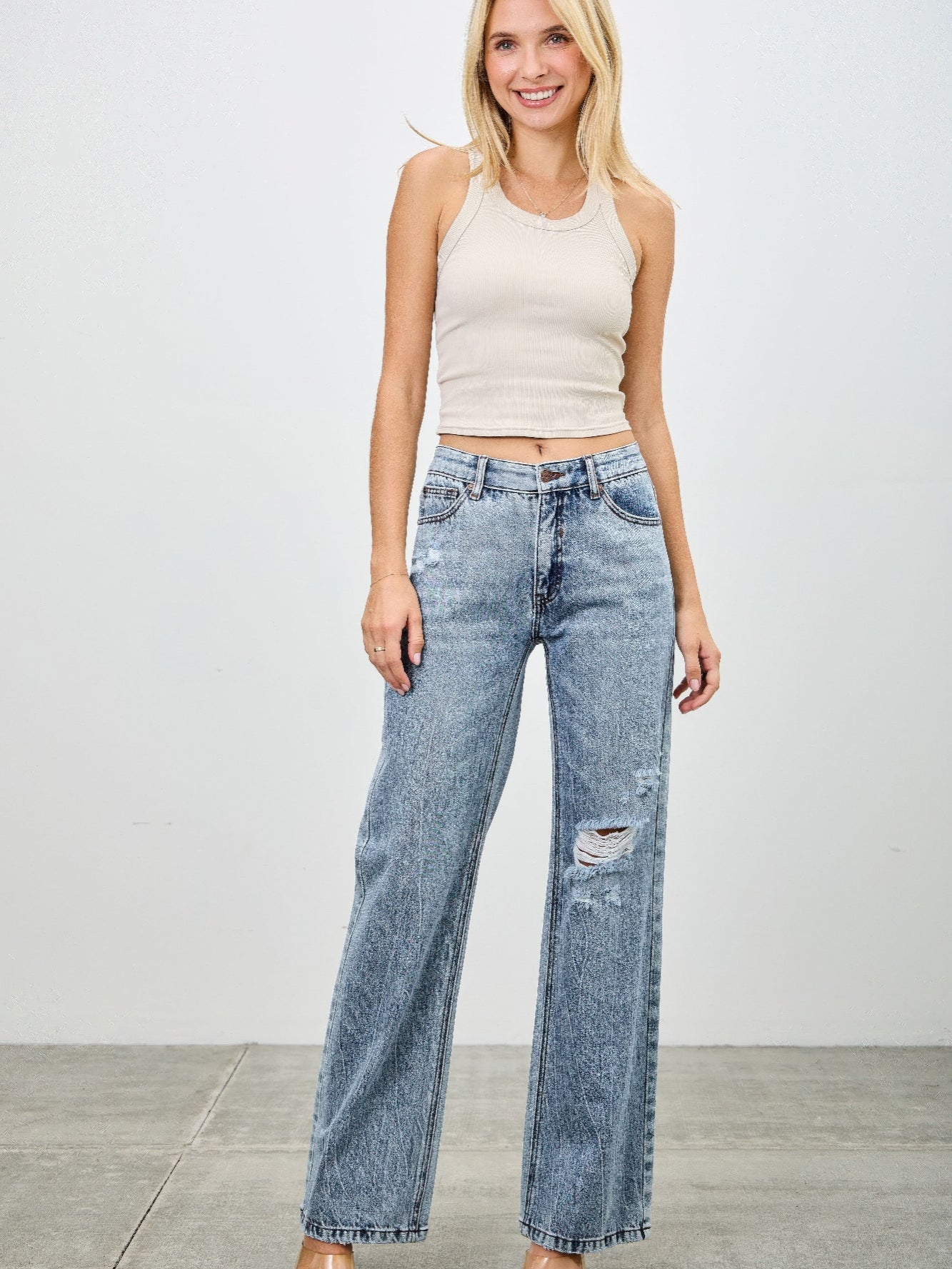 Model wearing Mid Rise Relaxed Straight With Destroy jeans, showcasing relaxed fit and destroyed detailing.
