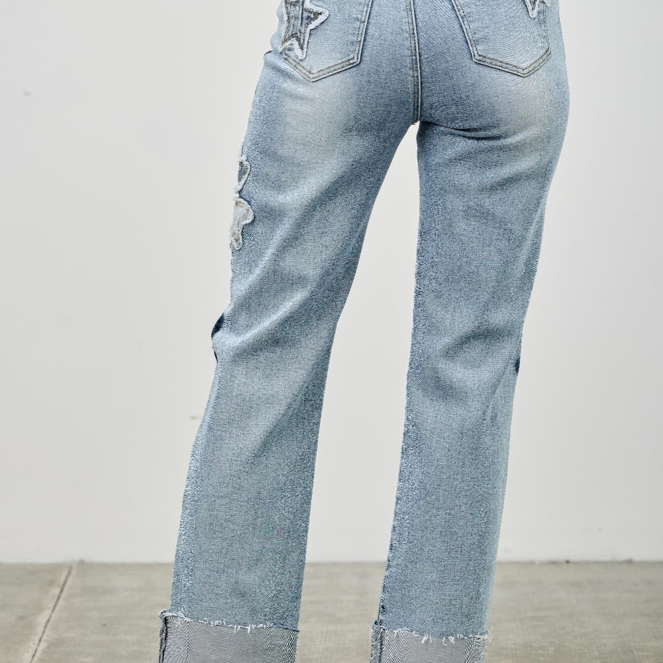 High Rise Star & Heart Patched Dad Jean W/stretch showcasing star patchwork and relaxed straight-leg silhouette.