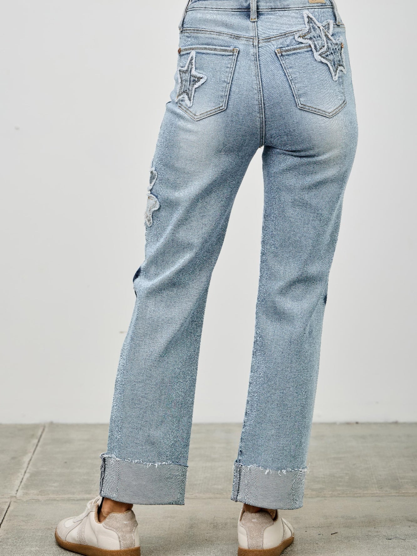 High Rise Star & Heart Patched Dad Jean W/stretch showcasing star patchwork and relaxed straight-leg silhouette.